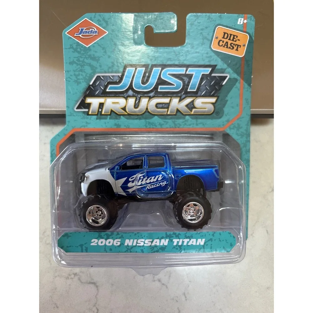 Jada Just Trucks 2006 Nissan Titan Blue White Die-Cast 1/64 Scale Lifted 4x4